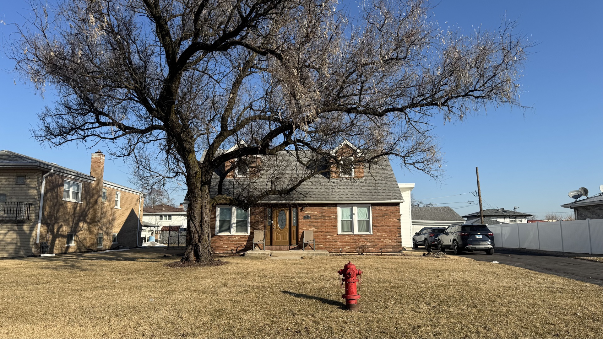 7700 West 83rd Street Bridgeview, IL 60455 - Photo 1 of 37 a view of a house with a yard and garage