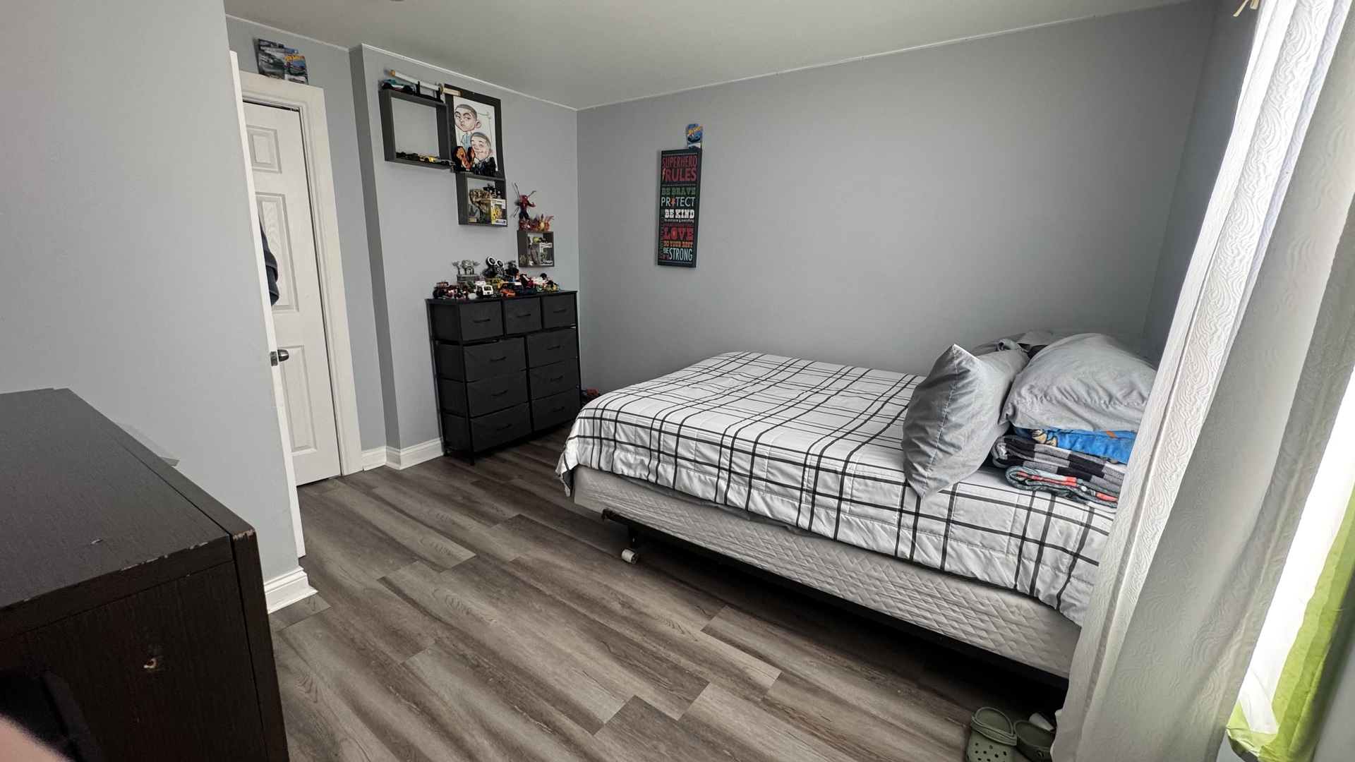 7700 West 83rd Street Bridgeview, IL 60455 - Photo 19 of 37 a bedroom with a bed and a window
