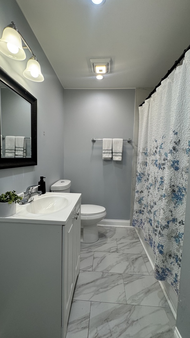 7700 West 83rd Street Bridgeview, IL 60455 - Photo 20 of 37 a bathroom with a sink a toilet and mirror