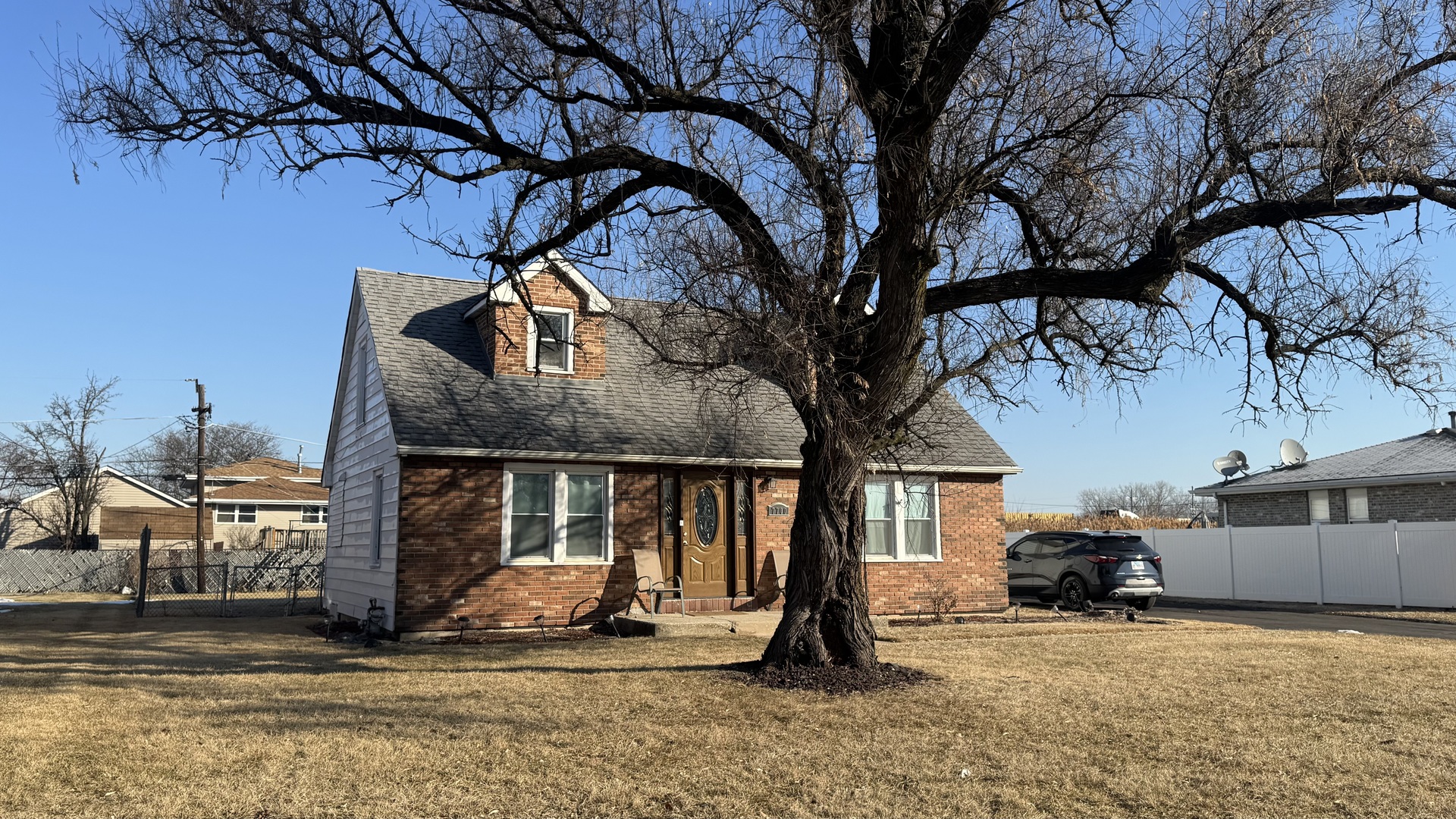 7700 West 83rd Street Bridgeview, IL 60455 - Photo 2 of 37 a view of a house with backyard porch and sitting area