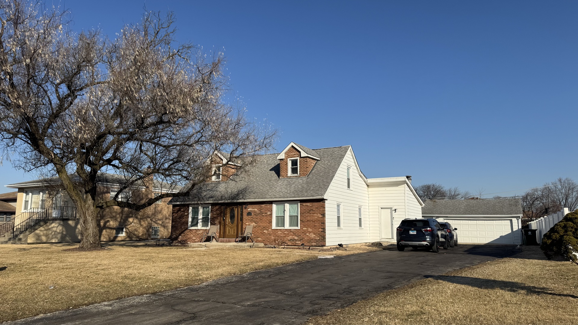 7700 West 83rd Street Bridgeview, IL 60455 - Photo 3 of 37 a front view of a house with a yard
