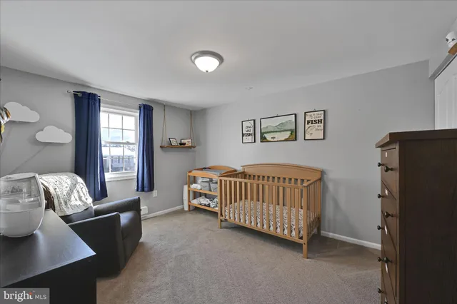 a bedroom with furniture and windows