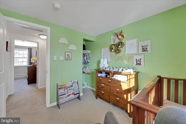 a bedroom with furniture and a wooden floor