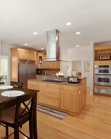 a bathroom with a sink a mirror and a window