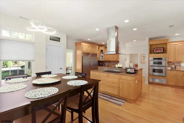 a white toilet sitting next to a window