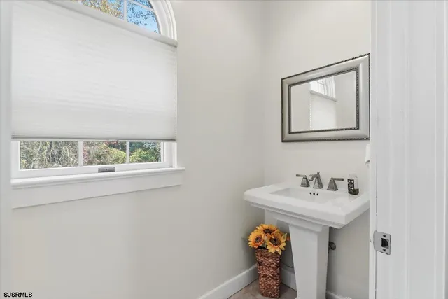 a kitchen with a sink cabinets and a stove