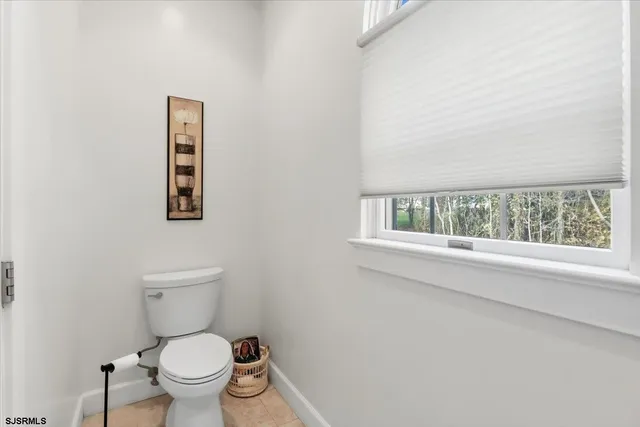a view of a livingroom with furniture and a fireplace