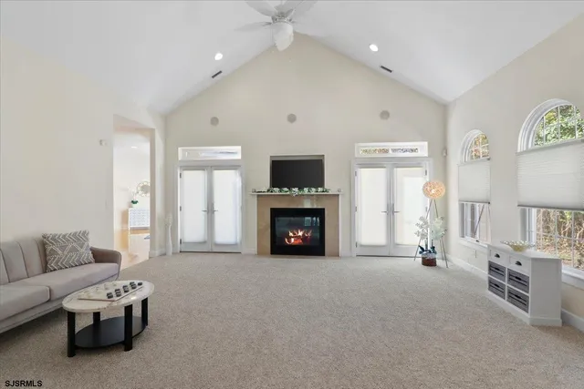 a living room with furniture and a table