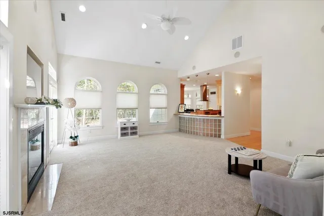 a view of a kitchen with a table and chairs in it