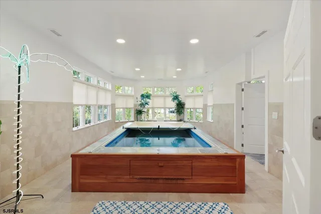 a view of a room with wooden floor and cabinet