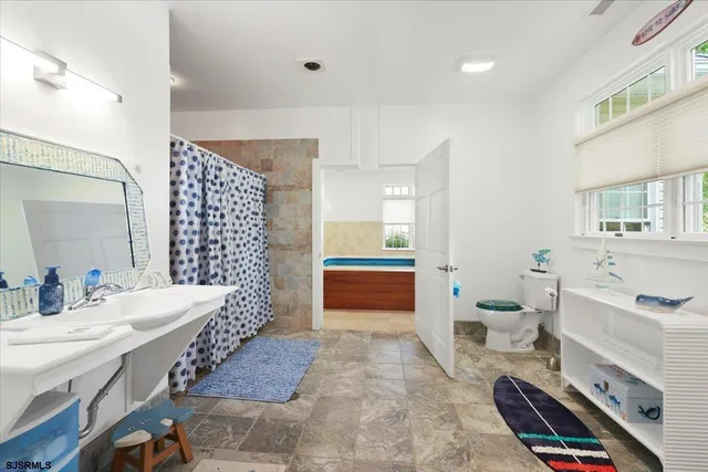 a bedroom with furniture and a gym equipment