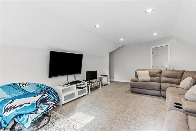 a view of a house with backyard and a porch