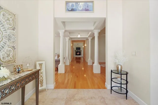 a very nice looking room with wooden floor and a rug