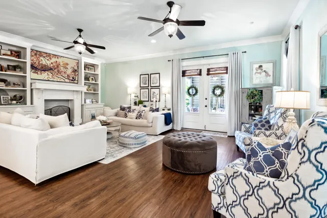 a living room with furniture a fireplace and a window