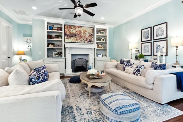a living room with furniture and a fireplace