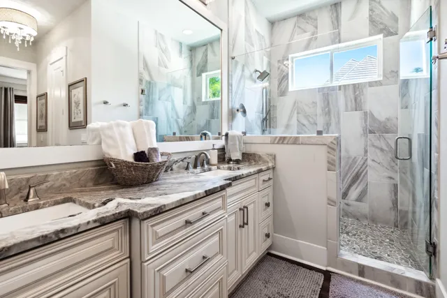 a very nice looking room with kitchen island furniture and a chandelier