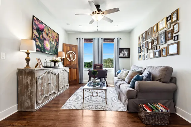 a bedroom with furniture and a wooden floor