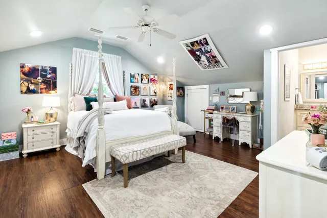 a bedroom with furniture and a flat screen tv