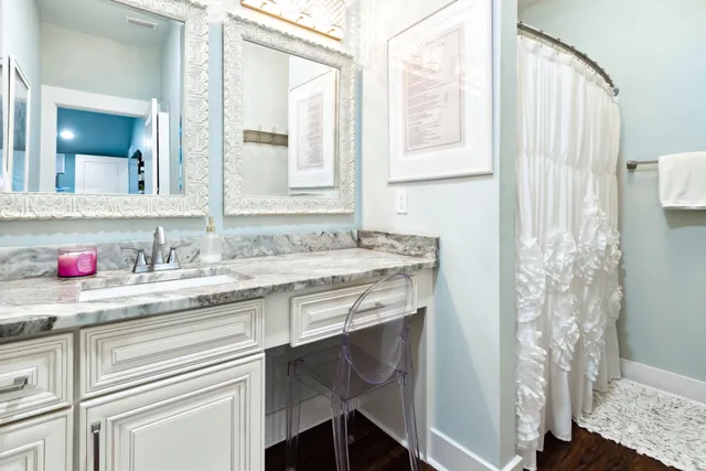 a bedroom with a bed and flat screen tv