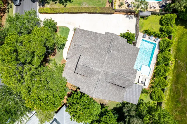 a view of a house with a small yard and plants