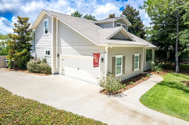 a view of a backyard with sitting area