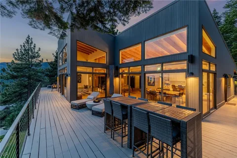 a outdoor space with lots of furniture and wooden floor