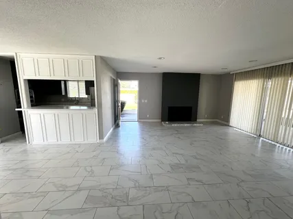 a kitchen that has a sink and a stove in it