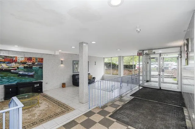 a living room with a couch and a rug