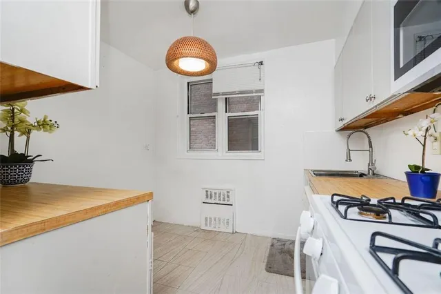 a kitchen with a stove and a microwave