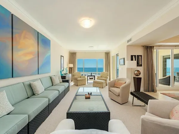 a living room with furniture and a large window