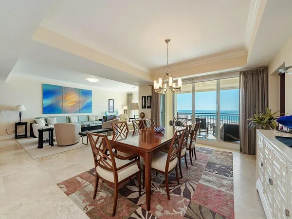 a view of a dining room with furniture window and outside view