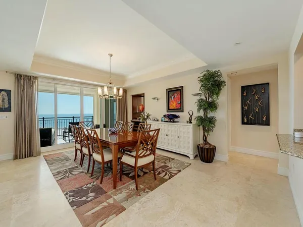 a view of a dining room with furniture and window