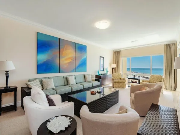 a living room with furniture and a large window