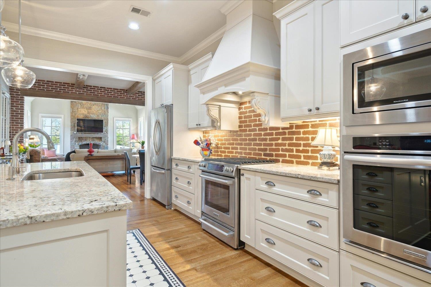 5140 Shady Grove Road Memphis, TN 38117 - Photo 13 of 39 a kitchen with granite countertop stainless steel appliances and stove top oven