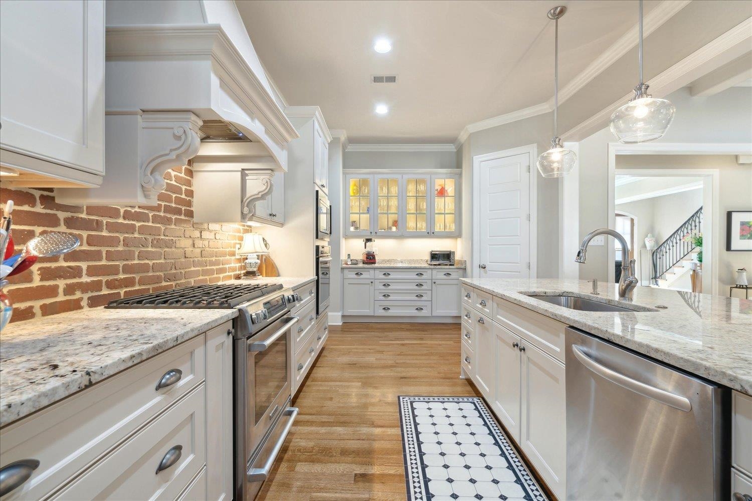 5140 Shady Grove Road Memphis, TN 38117 - Photo 14 of 39 a large kitchen with a sink and cabinets