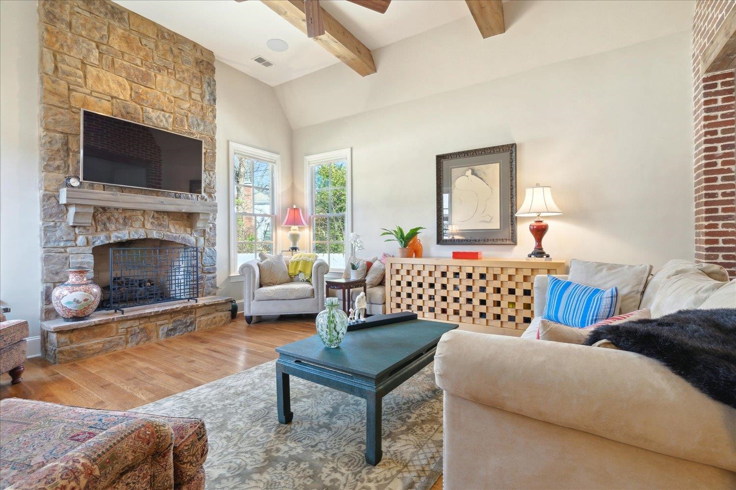 5140 Shady Grove Road Memphis, TN 38117 - Photo 18 of 39 a bedroom with a bed a couch and a fireplace