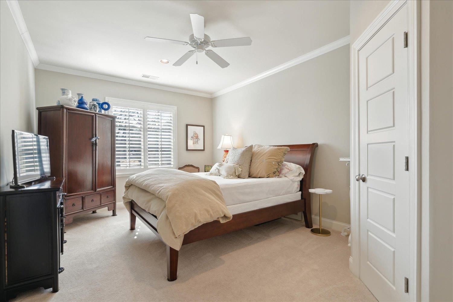 5140 Shady Grove Road Memphis, TN 38117 - Photo 27 of 39 a bedroom with a bed dresser and a window
