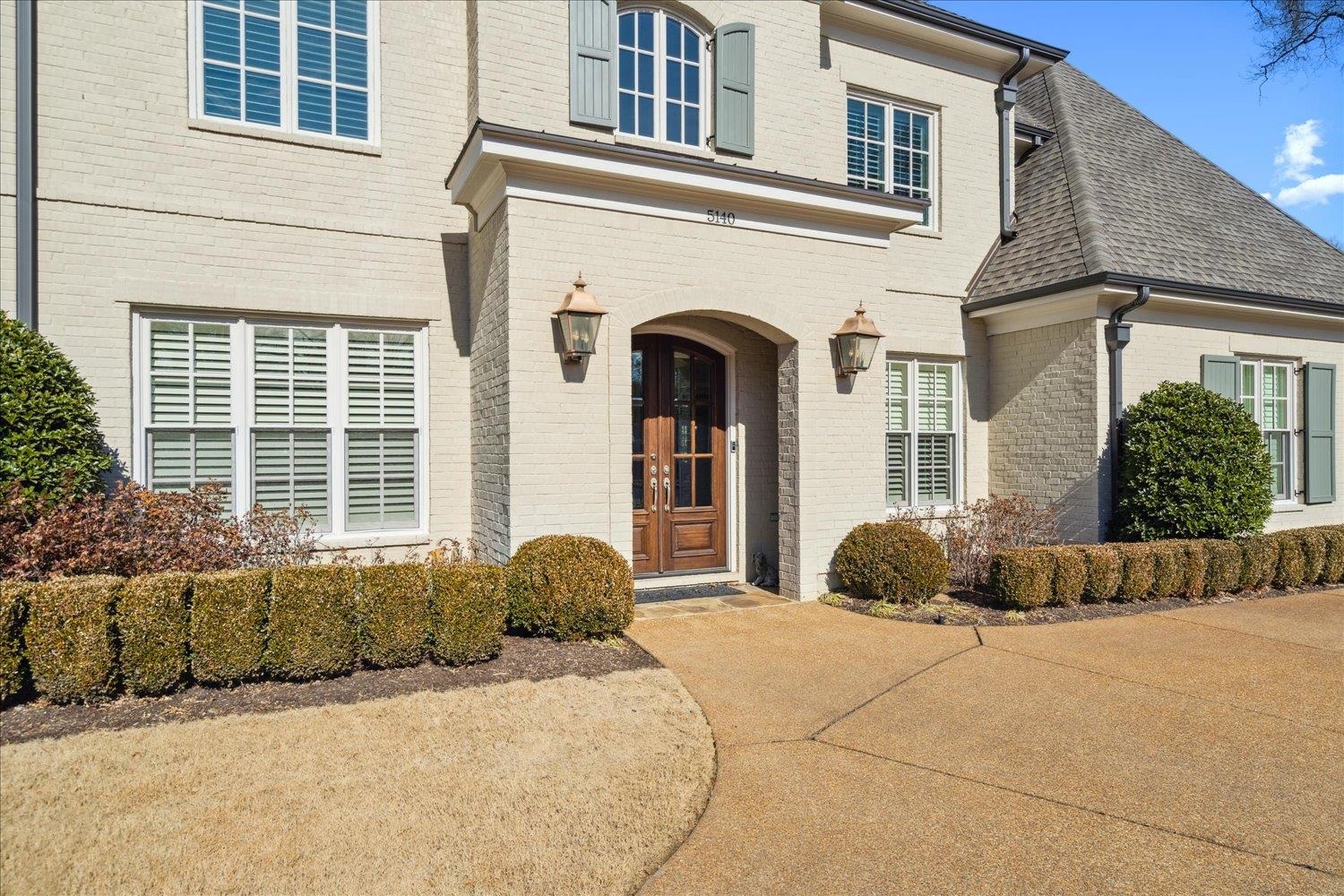 5140 Shady Grove Road Memphis, TN 38117 - Photo 3 of 39 a front view of a house with a yard