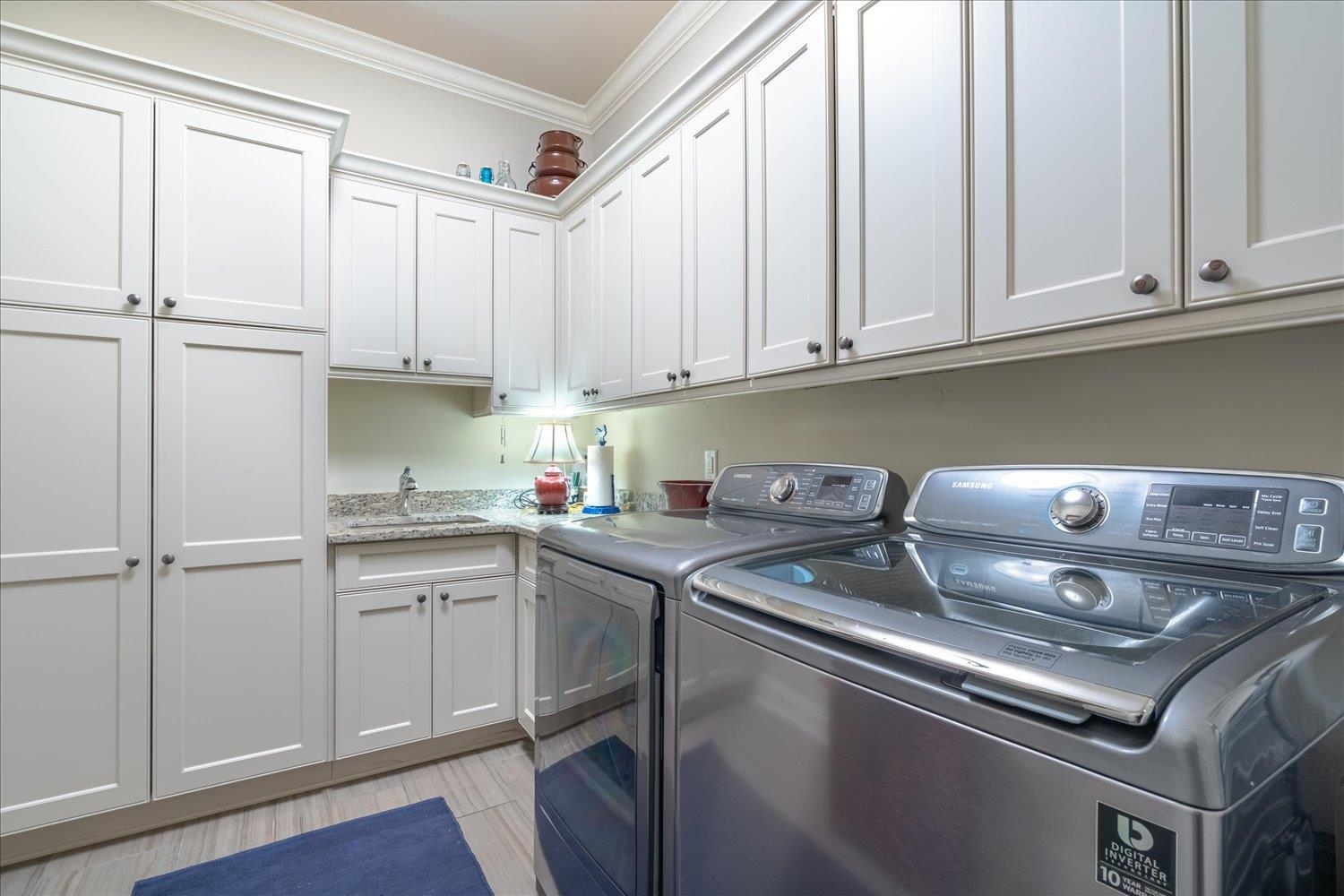 5140 Shady Grove Road Memphis, TN 38117 - Photo 34 of 39 a kitchen with stainless steel appliances granite countertop a sink stove and cabinets