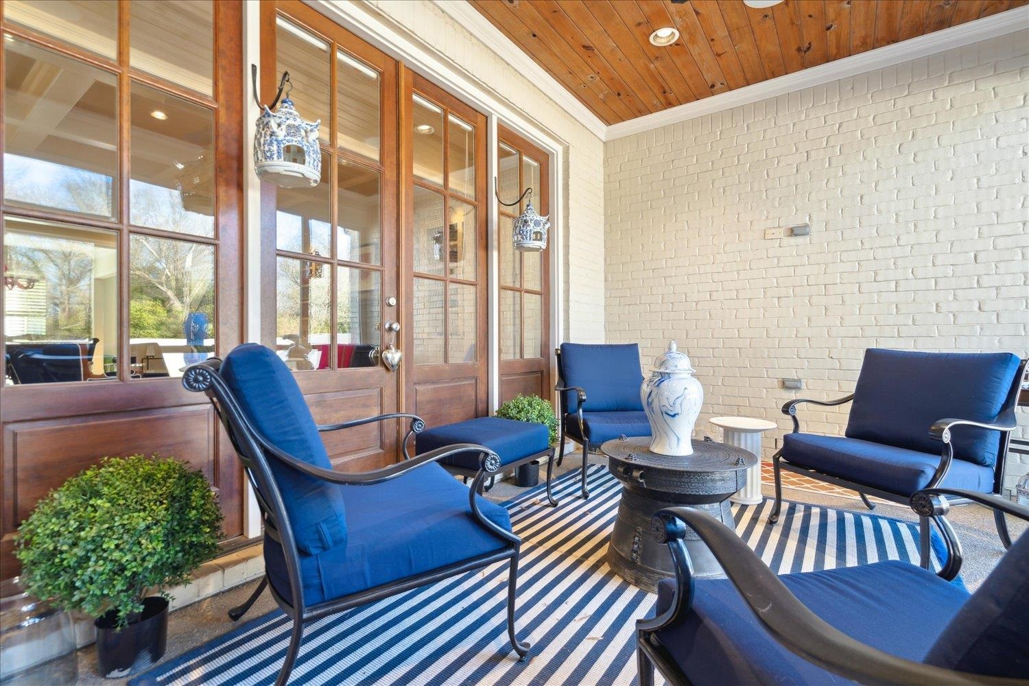 5140 Shady Grove Road Memphis, TN 38117 - Photo 37 of 39 a view of a patio with couches chairs dining table and chairs