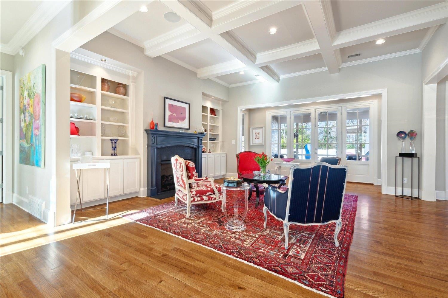 5140 Shady Grove Road Memphis, TN 38117 - Photo 9 of 39 a dining room with furniture a fireplace and wooden floor