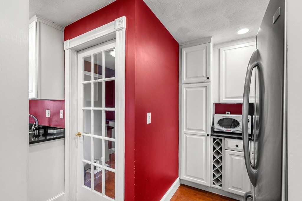 5 Harrison Street Maynard, MA 01754 - Photo 14 of 29 a view of hallway with stairs and furniture