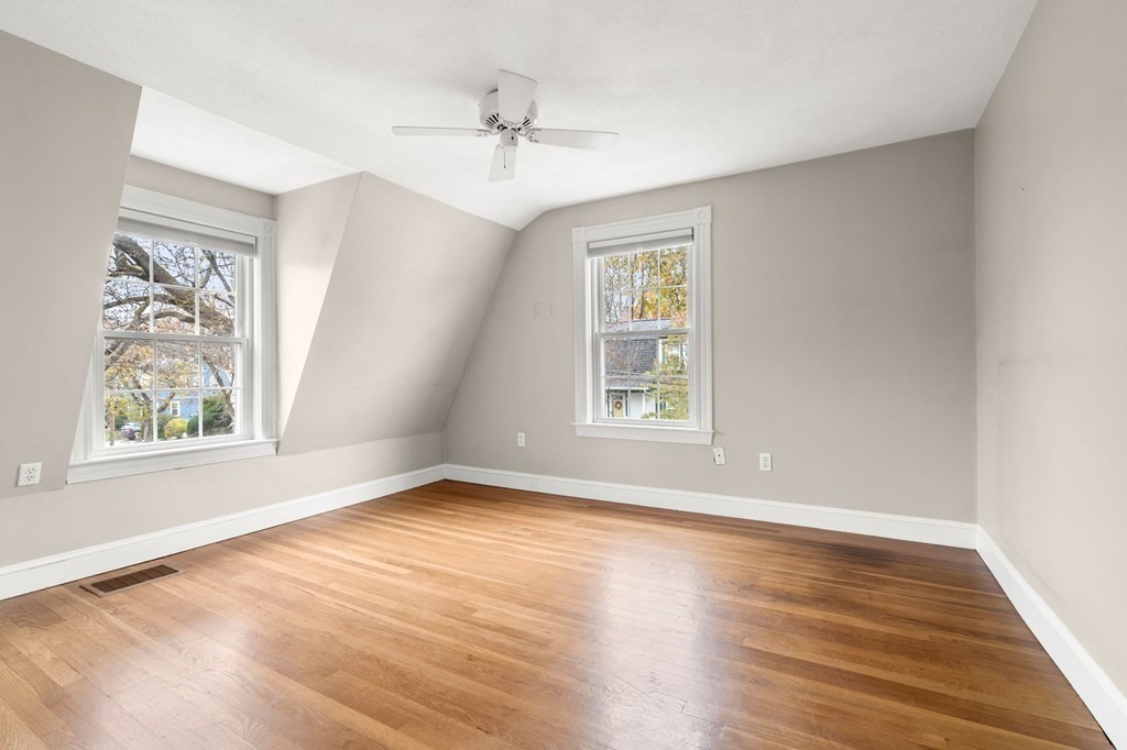 5 Harrison Street Maynard, MA 01754 - Photo 18 of 29 wooden floor in an empty room with a window