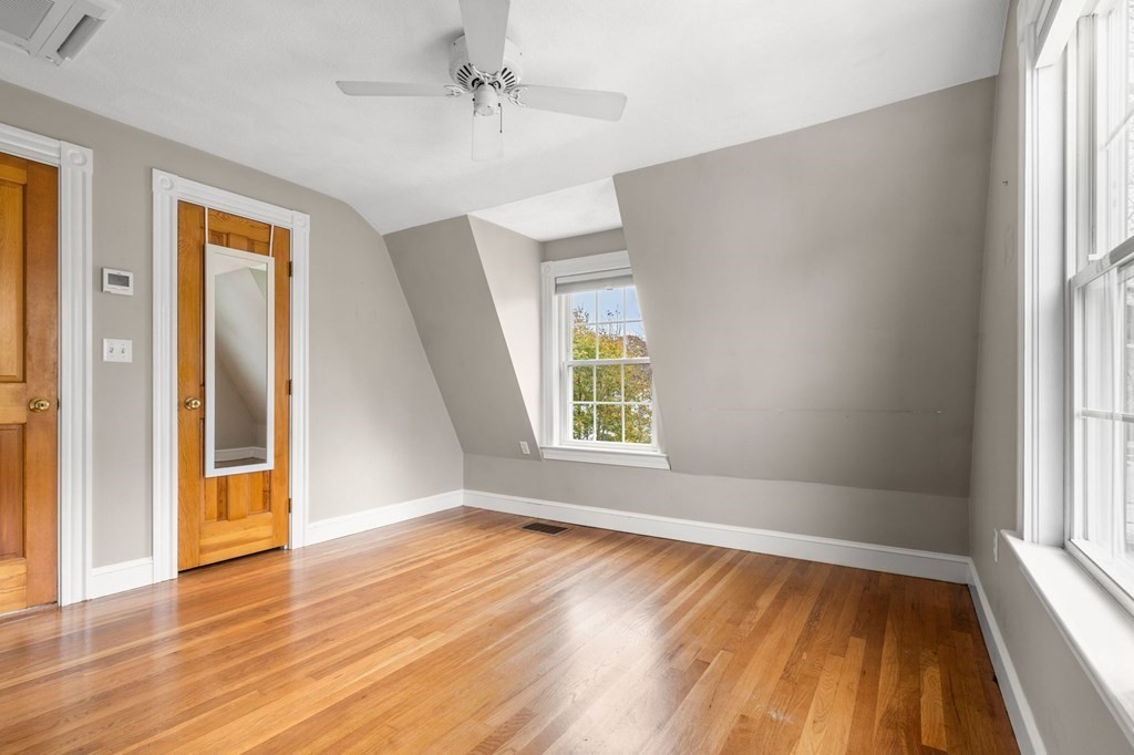 5 Harrison Street Maynard, MA 01754 - Photo 19 of 29 wooden floor in an empty room with a window