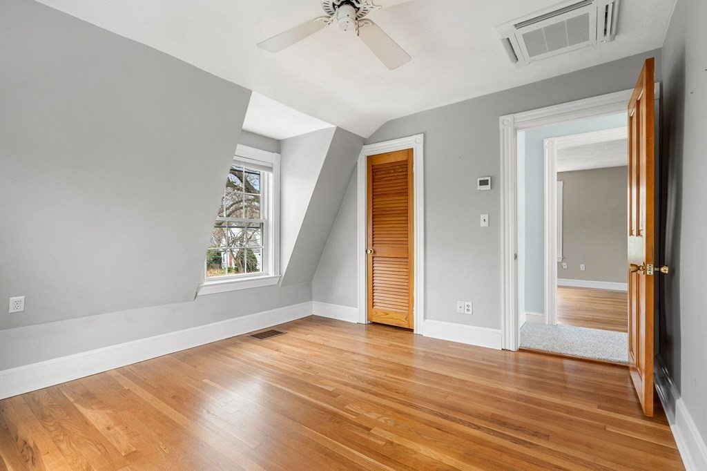 5 Harrison Street Maynard, MA 01754 - Photo 23 of 29 an empty room with wooden floor cabinet and windows