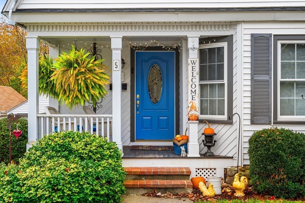 5 Harrison Street Maynard, MA 01754 - Photo 3 of 29 a front view of a house with a garden