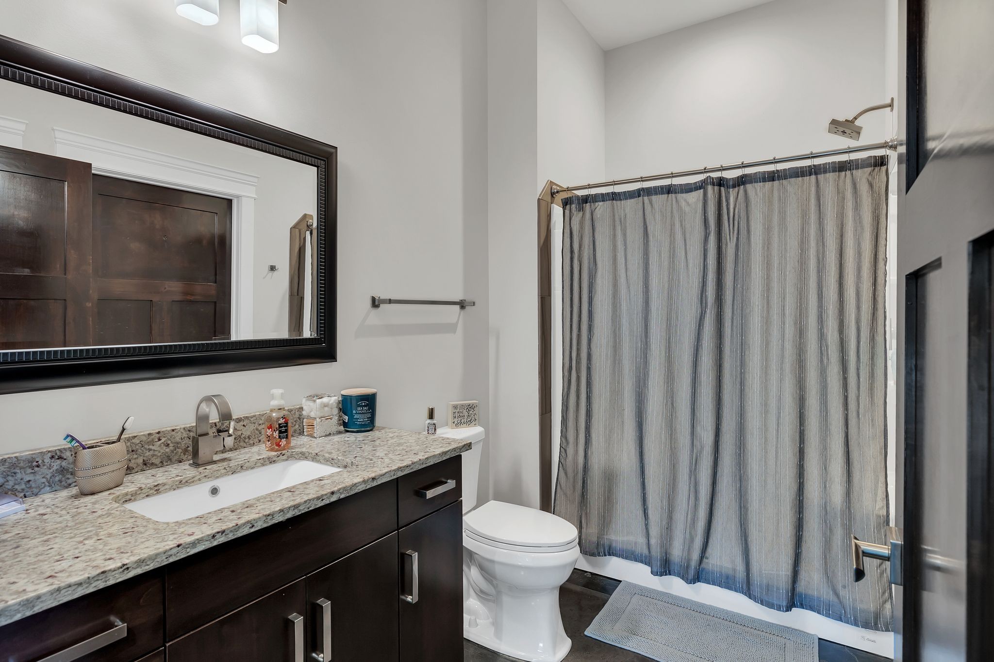 8200 Mona Road Murfreesboro, TN 37129 - Photo 28 of 73 a bathroom with a granite countertop sink toilet and mirror