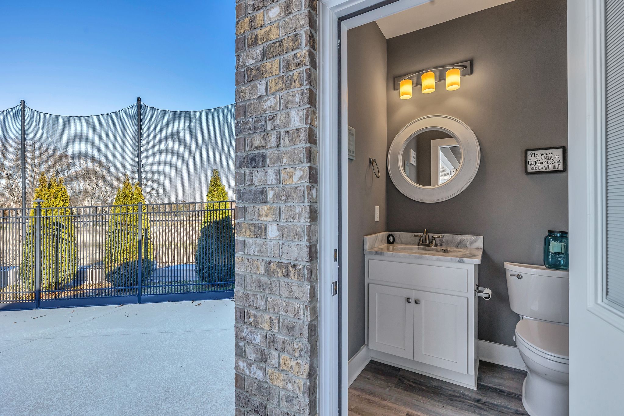 8200 Mona Road Murfreesboro, TN 37129 - Photo 51 of 73 a bathroom with a toilet a sink and a mirror