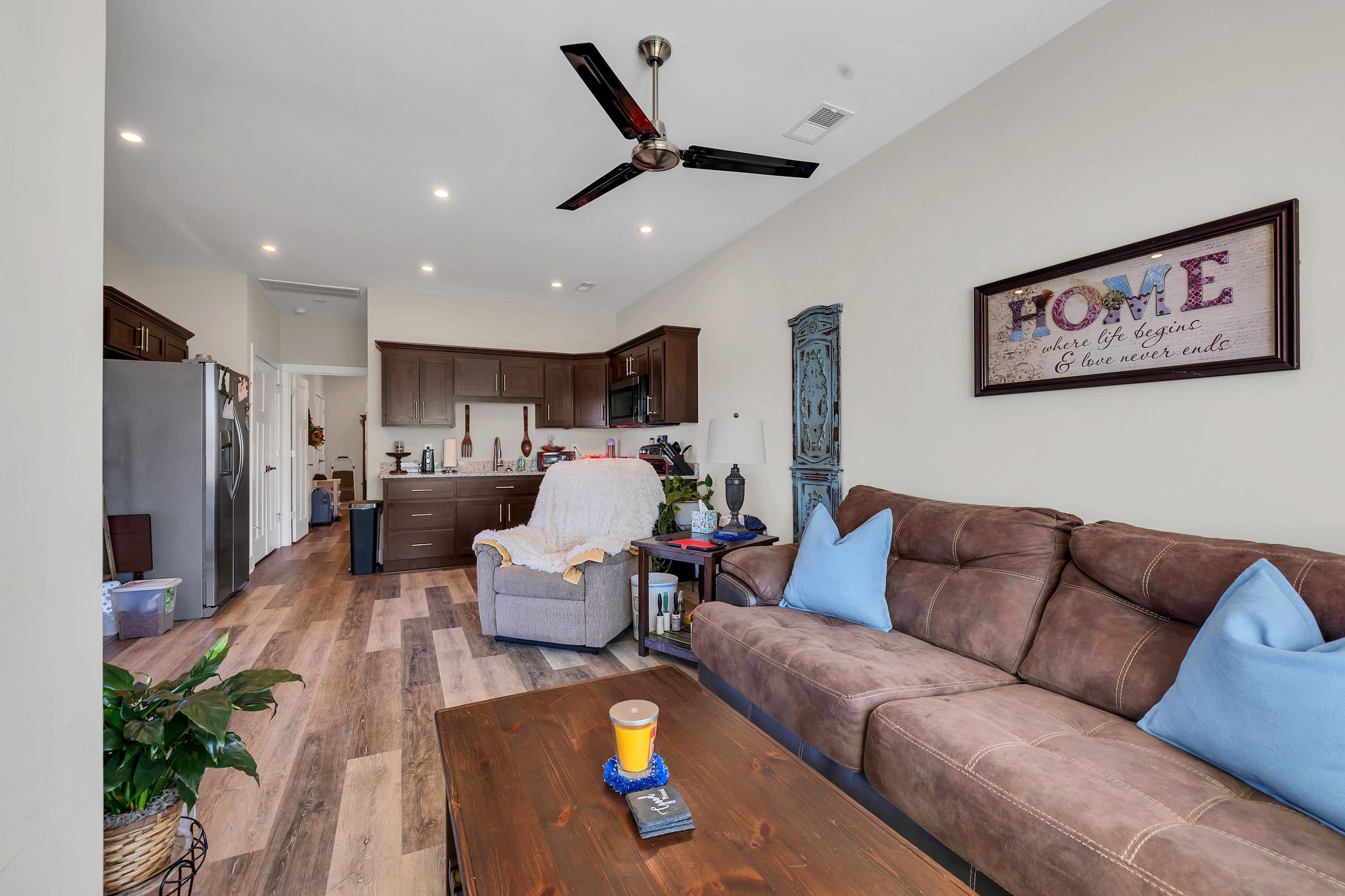 8200 Mona Road Murfreesboro, TN 37129 - Photo 57 of 73 a living room with furniture kitchen view and a chandelier