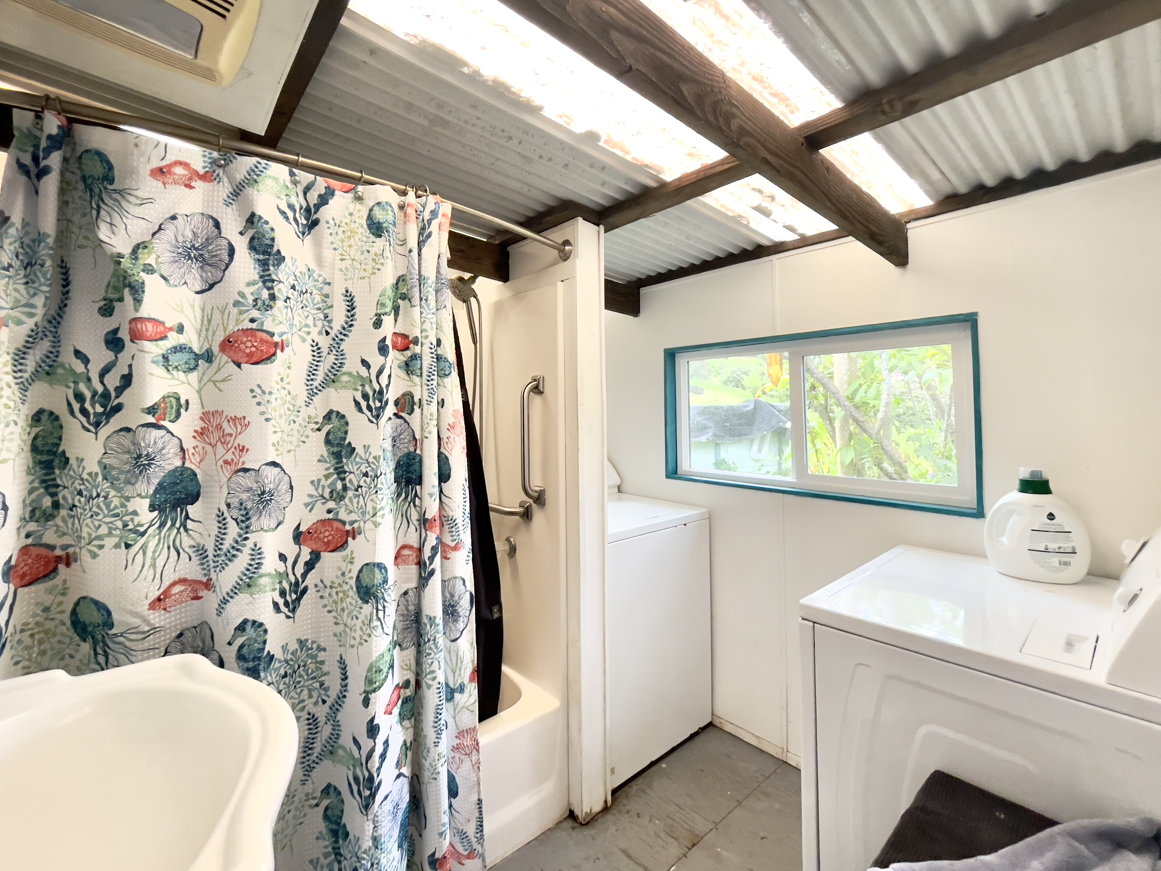 84-539 Telephone Exchange Road Captain Cook, HI 96704 - Photo 11 of 30 a bathroom with a sink and mirror with bathtub